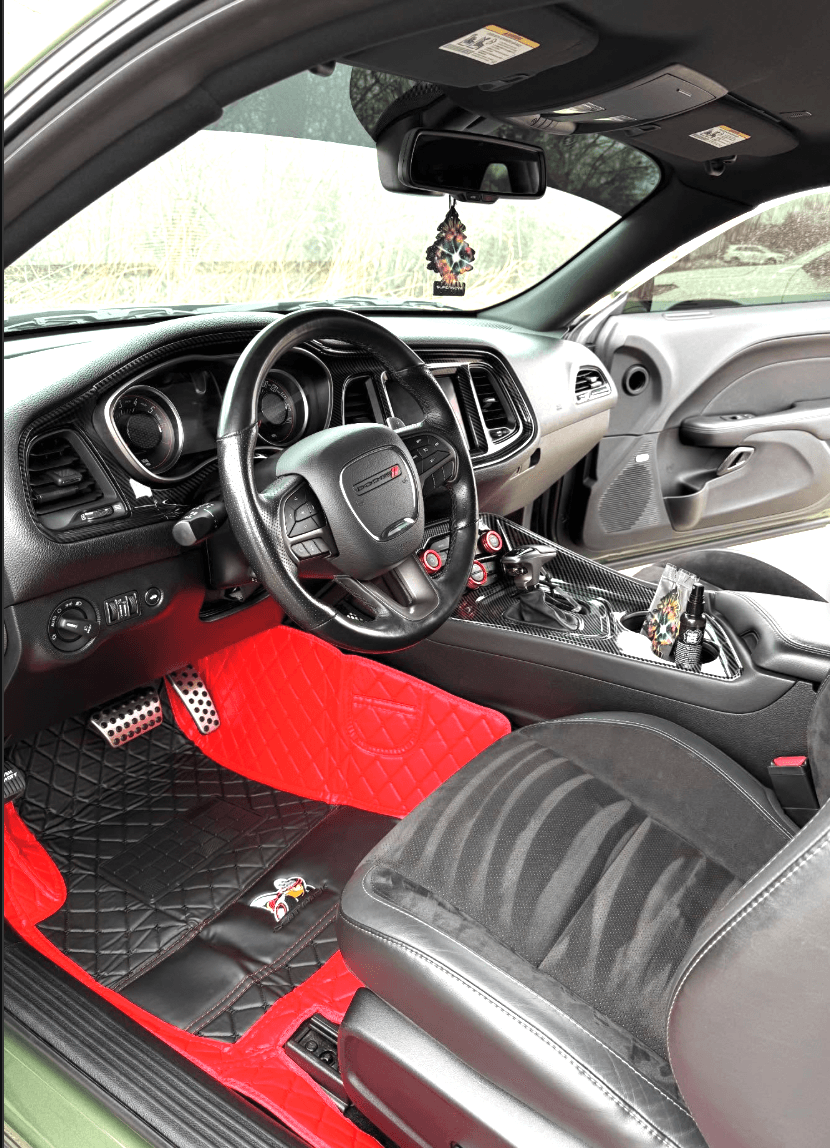 Dodge Challenger interior after a full interior detail — red and black leather with diamond floor mats